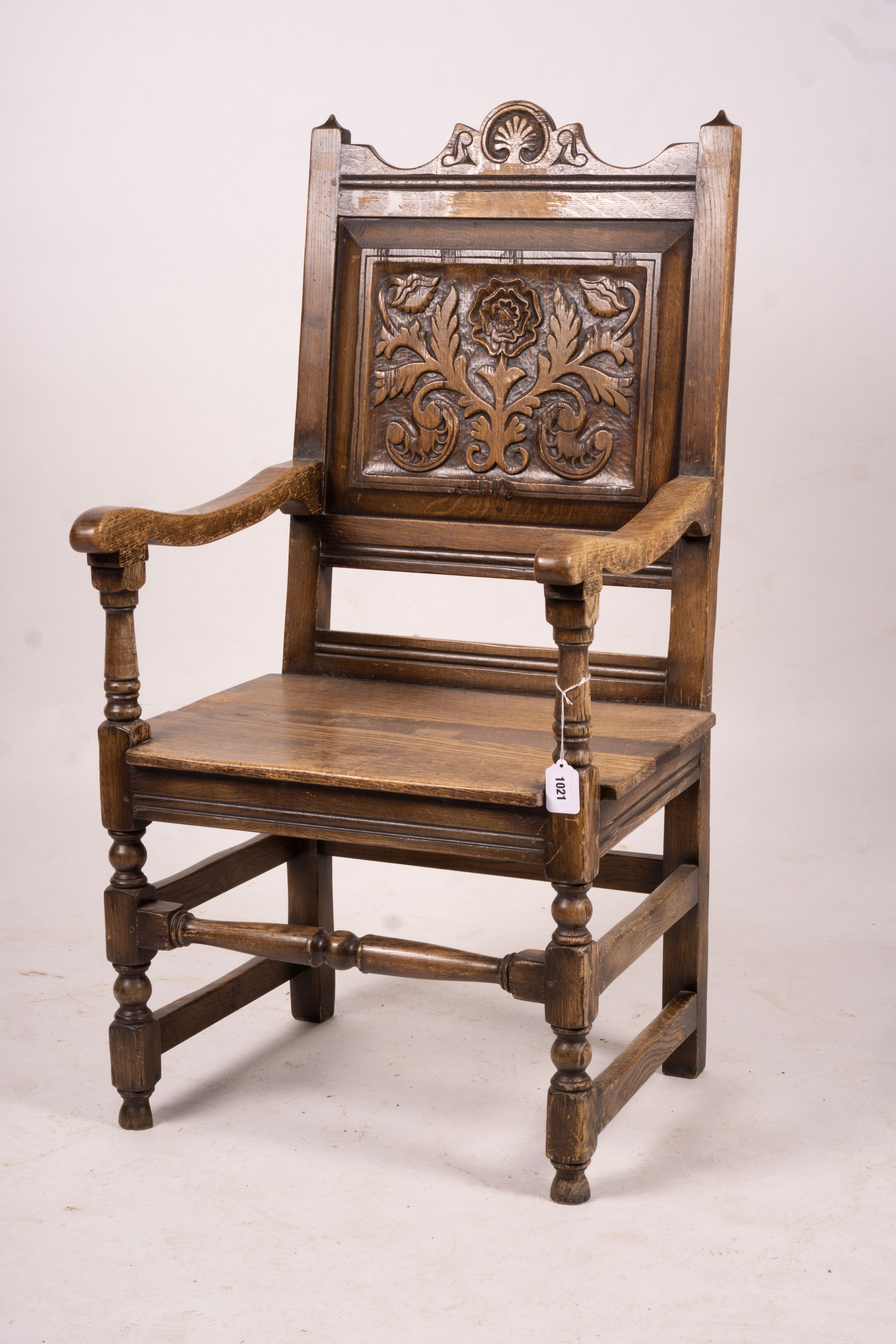 An early 20th century carved oak wainscot chair